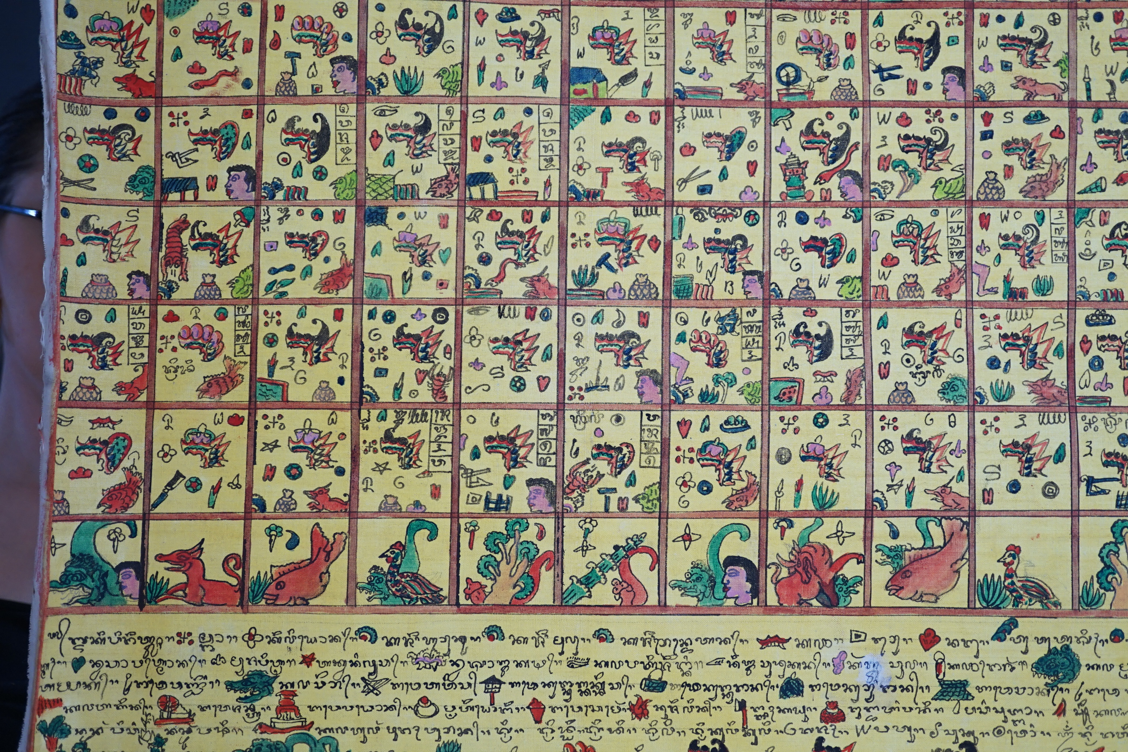 An Indonesian hand painted calendar and two similar figures, tallest 21cm